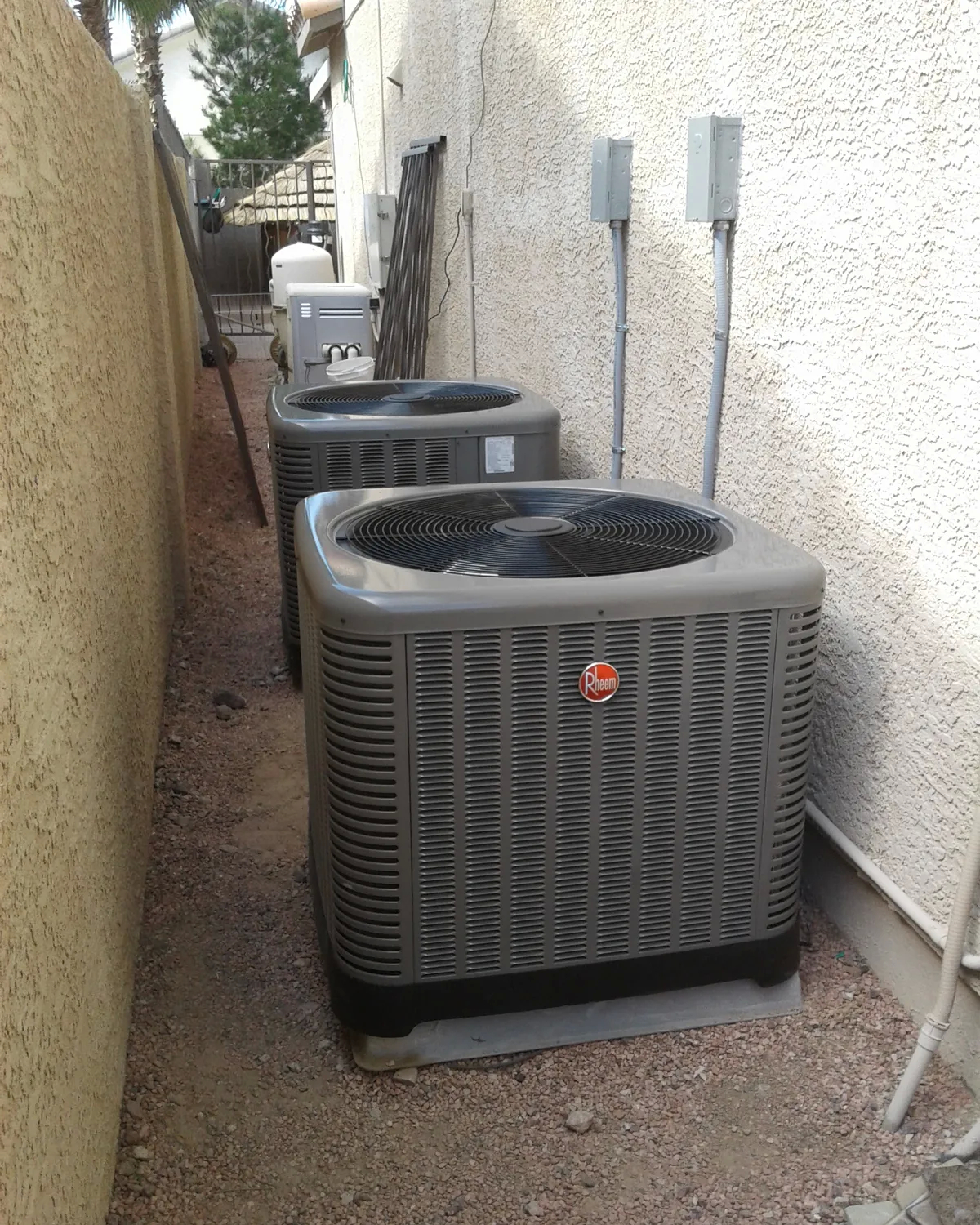 HVAC units installed in alley between buildings